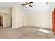 A bright, neutral-toned bedroom featuring vaulted ceilings and a ceiling fan for added comfort at 386 Creek Manor Way, Suwanee, GA 30024