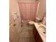 Neutral bathroom with a toilet, sink, and shower/tub combo at 6163 Princeton Ave, Morrow, GA 30260