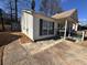 Well-kept single-story home with neat yard, charming porch, and a convenient paved driveway at 6163 Princeton Ave, Morrow, GA 30260