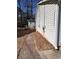 Exterior view of the side of a home and a detached shed at 6163 Princeton Ave, Morrow, GA 30260