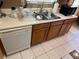 Practical kitchen design with essential appliances, ample countertop space, and classic wood cabinets at 6163 Princeton Ave, Morrow, GA 30260