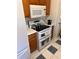 Functional kitchen showcasing stainless steel appliances, plenty of storage, and durable tiled floors at 6163 Princeton Ave, Morrow, GA 30260