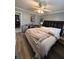Relaxing bedroom with a stylish bed, warm lighting, and neutral tones creating a calm atmosphere at 6163 Princeton Ave, Morrow, GA 30260