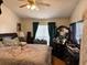Cozy bedroom with a comfortable bed, dark wood furniture, and soft, inviting decor at 6163 Princeton Ave, Morrow, GA 30260