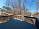 A back deck gives elevated views of the neighborhood beyond the wooded area, with plenty of room for patio furniture at 6302 Manassas Nw Pass, Acworth, GA 30101