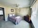 Cozy bedroom featuring a ceiling fan and a large window with natural light at 6302 Manassas Nw Pass, Acworth, GA 30101