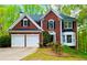Charming two-story brick home featuring a two-car garage and well-maintained landscaping at 6302 Manassas Nw Pass, Acworth, GA 30101