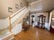 Inviting foyer with hardwood floors, staircase, and elegant decor at 6302 Manassas Nw Pass, Acworth, GA 30101