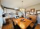 Cozy kitchen with white cabinets, a center island, and a casual dining area at 6302 Manassas Nw Pass, Acworth, GA 30101