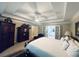 Spacious main bedroom featuring a tray ceiling, ceiling fan and ensuite bath with a glass door at 6302 Manassas Nw Pass, Acworth, GA 30101