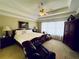This main bedroom has a tray ceiling, ceiling fan and is brightly lit with natural light at 6302 Manassas Nw Pass, Acworth, GA 30101
