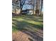 A large green lawn extends from the house to the back of the property at 184 Cedarcrest Dr, Acworth, GA 30101