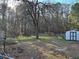 Spacious backyard with a fenced area and mature trees, offering a private outdoor retreat at 184 Cedarcrest Dr, Acworth, GA 30101