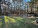 Large backyard featuring a playground, a storage shed, and fenced chicken coop at 184 Cedarcrest Dr, Acworth, GA 30101