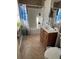 Bathroom with a bathtub, shower, vanity, and toilet with decorative plants adding a touch of freshness at 184 Cedarcrest Dr, Acworth, GA 30101