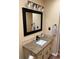Bathroom showcasing granite counters, and a black framed vanity mirror with attractive lighting at 184 Cedarcrest Dr, Acworth, GA 30101