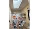 Bright bathroom featuring a skylight, cute ocean-themed shower curtain, and rustic wood shelving at 184 Cedarcrest Dr, Acworth, GA 30101