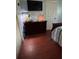 Bedroom with a wooden dresser and television for relaxation and entertainment at 184 Cedarcrest Dr, Acworth, GA 30101