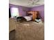 This bedroom features a carpeted floor, purple walls, a window, and a bunk bed at 184 Cedarcrest Dr, Acworth, GA 30101