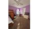 A bedroom with a bunk bed, desk, and colorful purple walls and carpeted floor at 184 Cedarcrest Dr, Acworth, GA 30101