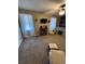 Spacious bedroom featuring carpet, a ceiling fan, natural light, and unique decor at 184 Cedarcrest Dr, Acworth, GA 30101
