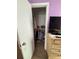 View into a closet reveals clothes, shoes, and organized storage solutions in the bedroom at 184 Cedarcrest Dr, Acworth, GA 30101