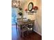 Cozy dining area features a wooden table, stylish chandelier, and charming wall decor for a warm and inviting atmosphere at 184 Cedarcrest Dr, Acworth, GA 30101