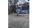 Two-story home with blue siding, a dark roof, and mature trees in the front yard at 184 Cedarcrest Dr, Acworth, GA 30101