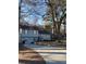 Charming two-story home with inviting curb appeal, set against a backdrop of mature trees and a neatly landscaped yard at 184 Cedarcrest Dr, Acworth, GA 30101