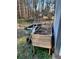 Side yard area with a cart, shovels and a custom built compost box at 184 Cedarcrest Dr, Acworth, GA 30101