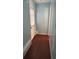 Entryway featuring wood floors, light blue walls, and a door with a window covering at 184 Cedarcrest Dr, Acworth, GA 30101