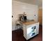 Kitchen island with granite countertops, a butcher block, white cabinets and seating for additional counter space at 184 Cedarcrest Dr, Acworth, GA 30101
