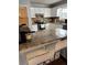 Kitchen island with granite countertops, white cabinets and stainless steel appliances in the background at 184 Cedarcrest Dr, Acworth, GA 30101