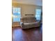 Bright living room featuring large windows, a neutral colored sofa and hardwood floors at 184 Cedarcrest Dr, Acworth, GA 30101