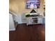 Cozy living room with wood floors and large TV at 184 Cedarcrest Dr, Acworth, GA 30101