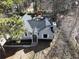 Aerial view of the house showcasing its architectural style, landscaping, and surrounding greenery at 98 Pace Dr, Hiram, GA 30141