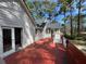 View of the house from the deck, showing the backyard with tall trees and blue sky at 98 Pace Dr, Hiram, GA 30141