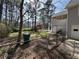 Spacious backyard with fencing, mature trees, pool, and an adjacent gazebo at 98 Pace Dr, Hiram, GA 30141