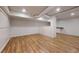 Finished basement offers wood-look floors, white walls, and modern recessed lighting at 98 Pace Dr, Hiram, GA 30141