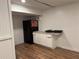 Finished basement featuring modern flooring, updated cabinetry, and a sleek refrigerator at 98 Pace Dr, Hiram, GA 30141