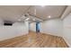 Finished basement with wood-look flooring, white painted walls, and recessed lighting at 98 Pace Dr, Hiram, GA 30141