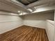Finished basement featuring wood look floors, with white walls, and recessed lighting, offering a modern aesthetic at 98 Pace Dr, Hiram, GA 30141