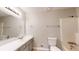 Bathroom featuring tub/shower combo, toilet, vanity with sink, mirror, and neutral paint at 98 Pace Dr, Hiram, GA 30141