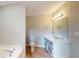 Bathroom featuring vanity, sink, mirror, and toilet, with tile flooring and neutral paint at 98 Pace Dr, Hiram, GA 30141