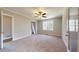 Spacious bedroom with neutral walls, carpet, ceiling fan, and walk-in closet at 98 Pace Dr, Hiram, GA 30141