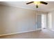 Bedroom features neutral carpet and an exterior access door to a sunroom at 98 Pace Dr, Hiram, GA 30141