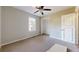 Neutral bedroom with carpet, one window, ceiling fan, and closet at 98 Pace Dr, Hiram, GA 30141
