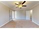 Spacious bedroom with carpet, ceiling fan, neutral walls, and glass patio doors at 98 Pace Dr, Hiram, GA 30141
