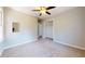 A cozy bedroom with neutral walls, carpet, ceiling fan, and closet at 98 Pace Dr, Hiram, GA 30141