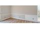 Bright dining room with wainscoting, wood flooring, and large window at 98 Pace Dr, Hiram, GA 30141